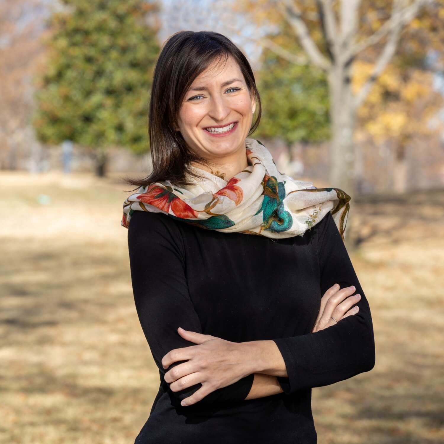 Jessi Rice Woods, Communities Director for Excel by Eight, standing confidently with a bright smile