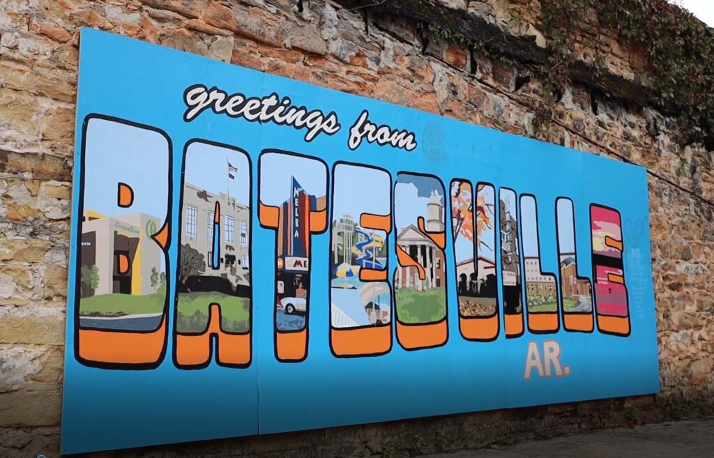 Colorful ‘Greetings from Batesville’ mural along a rustic stone wall in Independence County, Arkansas.